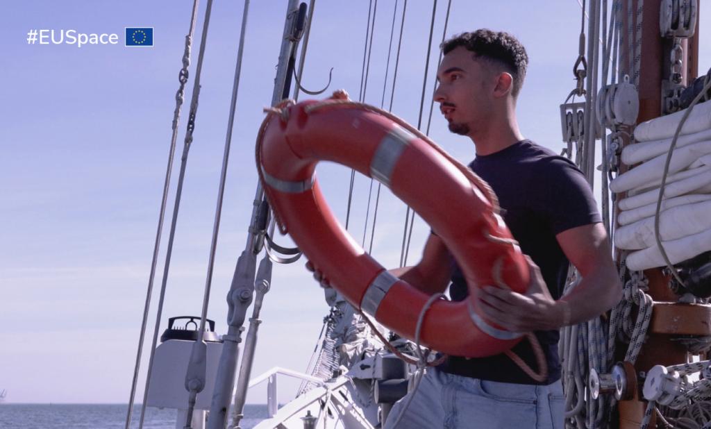 Person with lifesaver in the hands on a boat